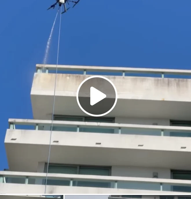 Close view of the drone beside the Bay Harbor Islands building façade