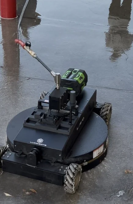 Robotic surface-cleaning equipment working on wet concrete