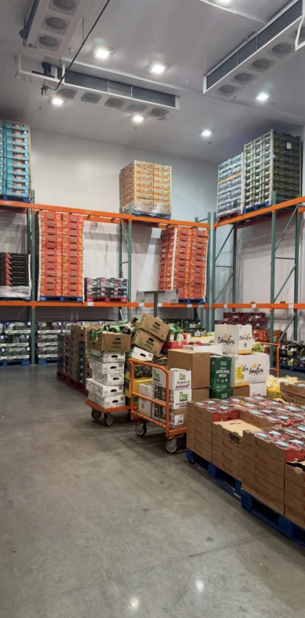 Palletized goods and storage aisles inside the commercial cooler