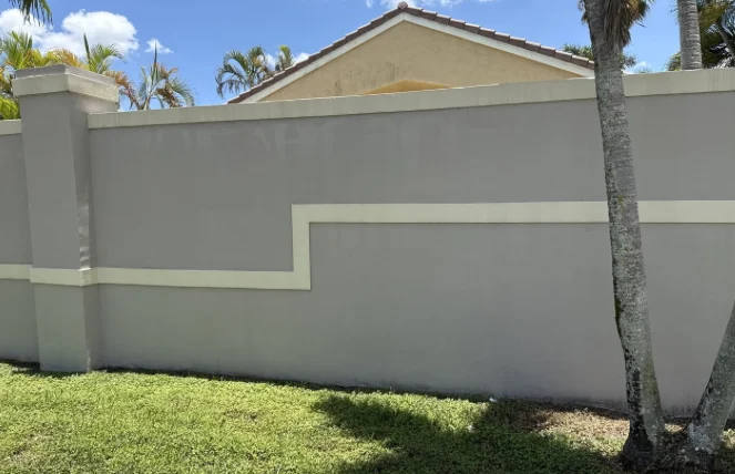 HOA perimeter wall and landscaped edge in Davie