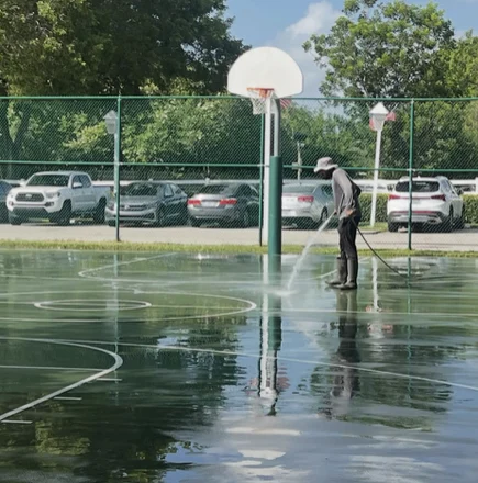 Another view of cleaning in progress on the HOA court
