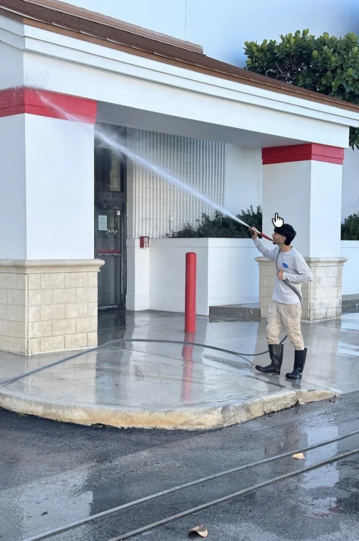 Pressure Kleen technician washing the Office Depot storefront exterior in Hialeah