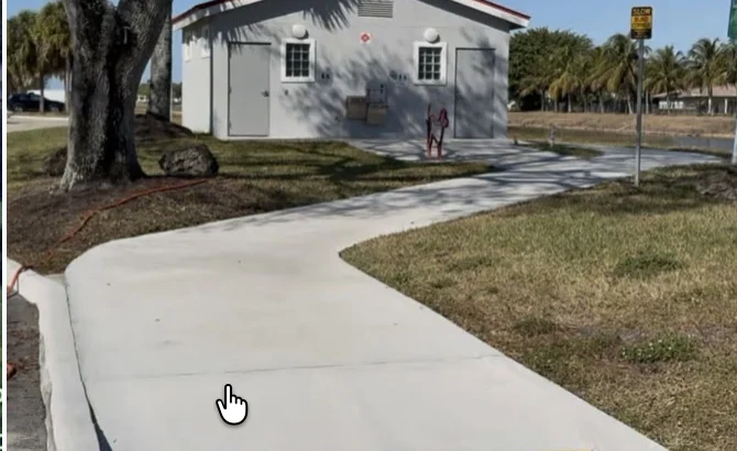 Clean sidewalk and park building at Veterans Park in Tamarac