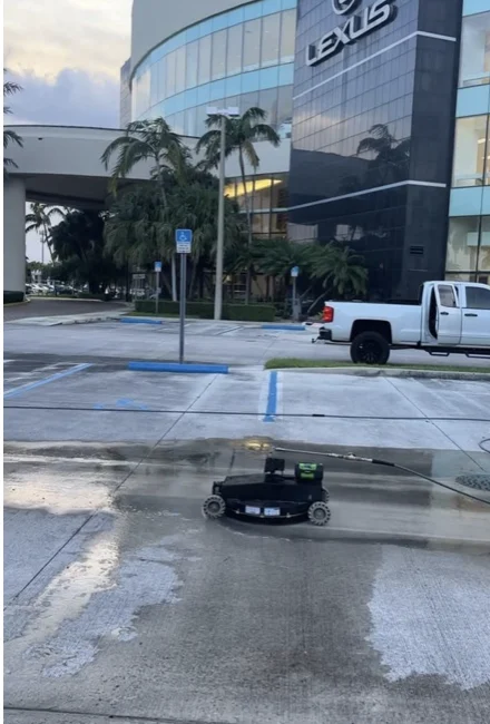 West Kendall Lexus dealership exterior and robotic cleaning equipment